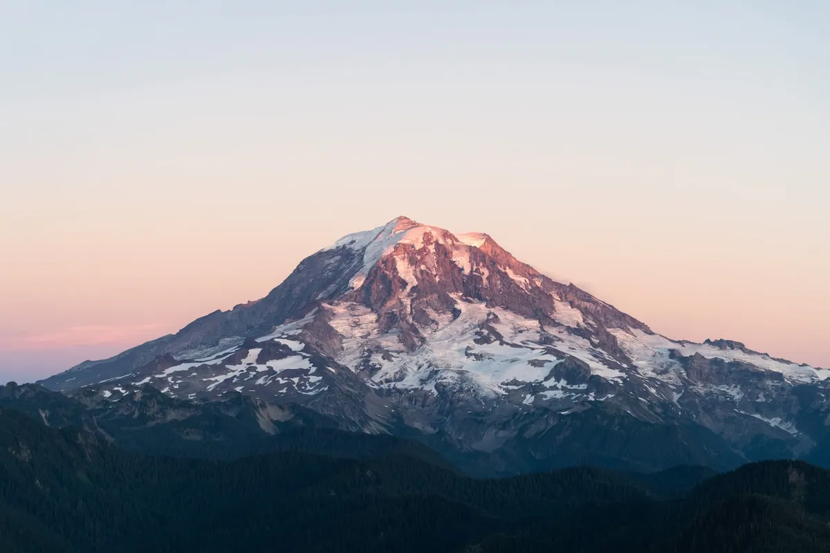 Mount Rainier above the Puget Sound region at sunset
